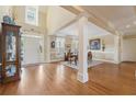 Bright and spacious living room featuring hardwood floors, large windows, and elegant trim, offering a comfortable living space at 6840 N Creekside Pt, Cumming, GA 30041