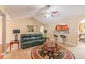 Bright living room showcasing a vaulted ceiling and seamless flow into the kitchen at 5780 Village Loop, Fairburn, GA 30213