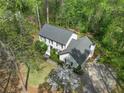 Aerial view of a beautifully landscaped home with mature trees and a private driveway at 292 Old Rosser Rd, Stone Mountain, GA 30087