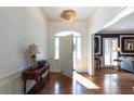Inviting foyer with hardwood floors, arched window and a stylish light fixture, offering a warm welcome at 139 W Paces Ferry Nw Rd, Atlanta, GA 30305