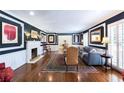 Elegant living room featuring hardwood floors, a fireplace, and refined decor with generous natural light at 139 W Paces Ferry Nw Rd, Atlanta, GA 30305