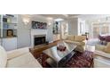 Cozy living room with a fireplace, built-in shelving, and stylish decor, perfect for relaxation at 6 Lullwater Ne Est, Atlanta, GA 30307
