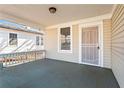 Inviting front porch featuring a secure entry door and a view of the neighborhood at 135 Adair Se Ave, Atlanta, GA 30315
