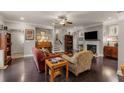 Comfortable living area with hardwood floors, fireplace, piano, and ample seating at 357 Murray Hill Ne Ave, Atlanta, GA 30317