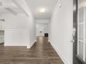 Welcoming entryway boasts hardwood floors, white walls, and leads to a spacious living area at 7181 Linden Dr, South Fulton, GA 30349