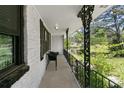 Outdoor porch area with dark metal rails and a view of the surrounding greenery at 3501 Wesley Chapel Rd, Decatur, GA 30034