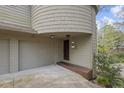 Inviting front entrance featuring a covered doorway and access to the attached garage at 1670 Nordic Trce, Marietta, GA 30068