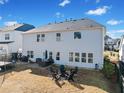 Large fenced backyard with a patio, furniture, and fire pit at 127 Crest Brooke Dr, Canton, GA 30115