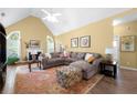 Spacious living area with a vaulted ceiling, a fireplace, a comfortable sectional, and a cozy atmosphere at 1478 Settlers Walk Sw Way, Marietta, GA 30060