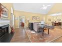 Open living space featuring a fireplace, a large comfortable sofa, and a dining area at 1478 Settlers Walk Sw Way, Marietta, GA 30060
