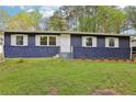 Inviting single-story home with painted brick and white trim, set on a well-maintained lawn at 2407 Ridgeway Dr, Doraville, GA 30360