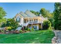 Beautiful two-story home with a lush green lawn and mature trees at 250 Blackberry Ln, Douglasville, GA 30134