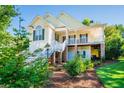 Charming house featuring a welcoming porch, well-kept landscaping, and a cozy ambiance at 250 Blackberry Ln, Douglasville, GA 30134