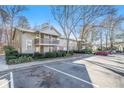 Apartment building featuring multiple units with balconies, parking, and landscaping at 2901 Lenox Ne Rd # 901, Atlanta, GA 30324