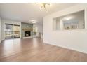 Open floor plan with hardwood floors, fireplace, and natural light at 2901 Lenox Ne Rd # 901, Atlanta, GA 30324