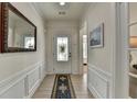 Light-filled hallway with decorative molding and a stylish rug, leading to other rooms at 4230 Braden Nw Ln, Kennesaw, GA 30144