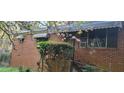 A charming brick home exterior features a blossoming tree in its front yard at 102 Welch St, Stockbridge, GA 30281