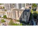 Aerial view of a tan midrise apartment building with many balconies at 1101 Juniper Ne St # 1511, Atlanta, GA 30309
