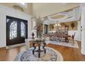 Elegant foyer with grand entrance, high ceilings, and hardwood floors at 2450 Weber Heights Way, Buford, GA 30519