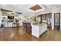 Spacious kitchen with granite countertops, stainless steel appliances, and breakfast bar at 2450 Weber Heights Way, Buford, GA 30519