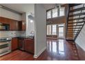 Open kitchen and living space with stainless steel appliances and hardwood floors at 264 19Th Nw St # 2308, Atlanta, GA 30363