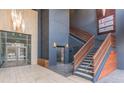 Grand lobby area featuring stairs, elevator, and signage for different businesses at 264 19Th Nw St # 2308, Atlanta, GA 30363
