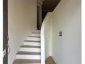 Bright entryway features hardwood floors, white stairs, and minimalist design at 4836 Se Merriman Se Walk # 23, Smyrna, GA 30080
