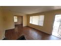 Comfortable living room with classic hardwood floors and ample sunlight streaming through the windows at 340 Adelle Se St, Atlanta, GA 30315