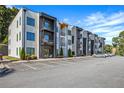 Modern apartment building featuring private balconies and ample parking spaces at 1155 Custer Se Ave # 209, Atlanta, GA 30316