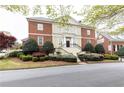 Beautiful brick house boasting lush landscaping, elegant stairs, and timeless design at 3022 Loridan Se Way, Atlanta, GA 30339