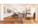 Elegant living room with fireplace, hardwood floors, built-in shelving, and abundant natural light at 3022 Loridan Se Way, Atlanta, GA 30339