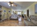 Spacious living room featuring wood-look laminate floors and neutral paint at 38 E Boxwood Se Dr, Cartersville, GA 30121