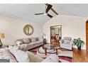 Cozy living room with hardwood floors, fireplace, and comfortable seating arrangement at 5429 Golfcrest Cir, Stone Mountain, GA 30088