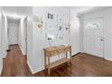Inviting entryway with hardwood floors, stylish decor, and a view of the hallway at 573 Lyle Se Dr, Marietta, GA 30067