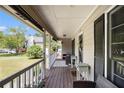 Covered front porch with wood flooring and comfortable seating at 258 Cristy Dr, Dallas, GA 30157