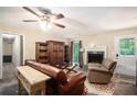 Inviting living room with a stone fireplace, plush seating, and decorative built-in shelving at 258 Cristy Dr, Dallas, GA 30157