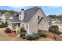 Back exterior featuring a new deck with stairs to the ground and a screened in porch at 52 Weatherstone Way, Dallas, GA 30157
