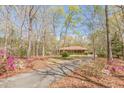 Secluded home surrounded by mature trees, offering a private and serene setting at 452 Hightower Ridge Rd, Covington, GA 30014