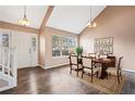 Elegant dining room features a large window, hardwood floors, and seating for six at 6422 Phillips Ct, Lithonia, GA 30058