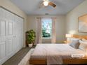 Cozy bedroom with natural light, plush carpet, and neutral tones, creating a serene retreat at 7747 Rountree Xing, Riverdale, GA 30274