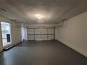 Spacious and clean garage with ample room for storage and parking with painted floor at 336 Sir Richard Ct, Jonesboro, GA 30236
