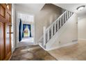 Welcoming foyer with tile flooring and a staircase leading to the upper level at 545 Bellemeade Sw Dr, Marietta, GA 30008