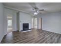 Bright living room with hardwood floors and a cozy fireplace feature at 643 Tumlin Lake Rd, Temple, GA 30179
