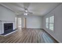 Bright living room with hardwood floors and a cozy fireplace feature at 643 Tumlin Lake Rd, Temple, GA 30179
