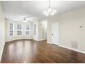Spacious living room featuring hardwood floors, neutral walls, abundant natural light from multiple windows at 109 Odyssey, Conyers, GA 30012