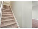 Carpeted staircase leading to the upper level at 109 Odyssey, Conyers, GA 30012