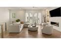 Bright living room featuring modern furnishings, fireplace, and hardwood floors, creating an inviting atmosphere at 1337 Grey Fox Ne Ct, Atlanta, GA 30306
