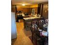 Cozy kitchen with breakfast bar and dining table at 6675 Hidden Brook Trl, Atlanta, GA 30349