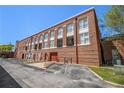 Beautiful brick exterior showcasing expansive windows and balcony feature for a unique living experience at 1133 Church St # 1, Covington, GA 30014
