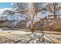 Street view showcasing charming homes with elevated front entrances and white picket fences at 944 Joseph E Boone Nw Blvd, Atlanta, GA 30314